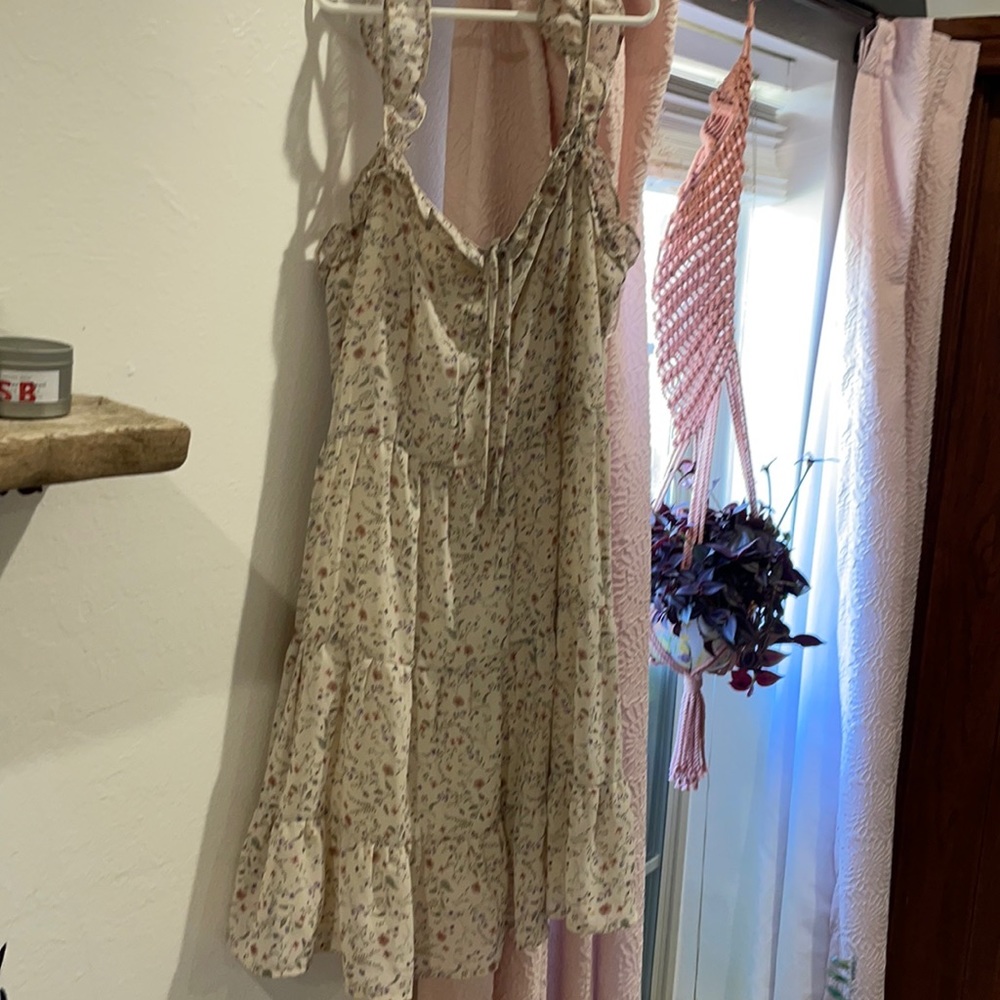 White and purple flowery dress.